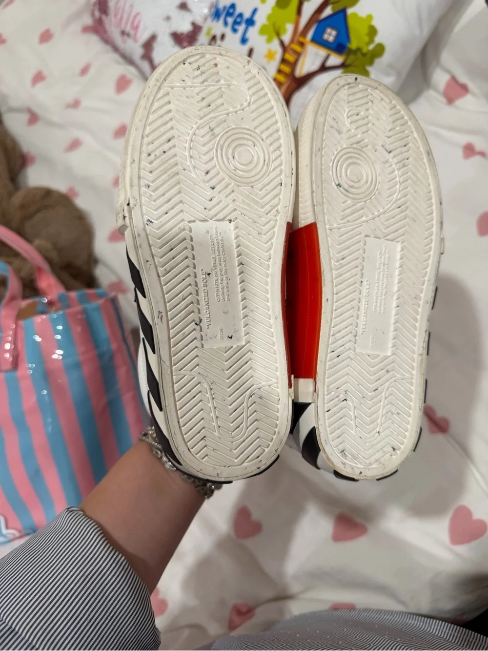 Off- White Sneakers with Black Arrow Logo and Red Lace Accent